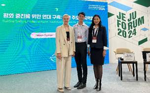 A group of people standing in front of a sign

AI-generated content may be incorrect.