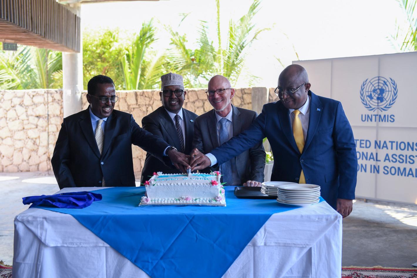 UN Special Representative James Swan with Somali ministers cutting a cake at the official launch of UNTMIS A photo of UN Special Representative James Swan with Somali ministers cutting a cake at the official launch of UNTMIS