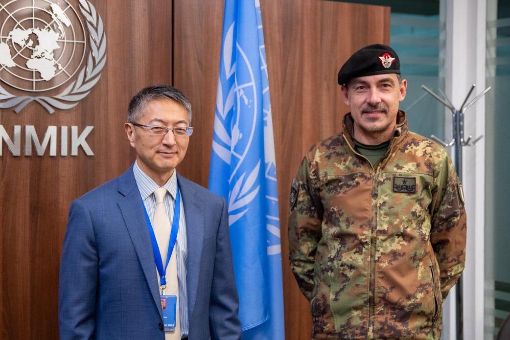 UNMIK Deputy Special Representative of the Secretary-General and Officer in Charge Milbert Dongjoon Shin standing beside the incoming Deputy Commander of KFOR, Brigadier General Federico Collina, at UNMIK Headquarters.
